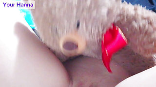 Innocent young girl plays with her teddy bear and her wet pussy with full lips