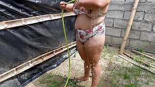 Exhibitionist ECUADORIAN sexy girl bathes in a public place and while she showers she touches her pussy and those giant tits very well.