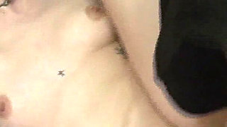 Tattooed Brunette Gets Fingered on the Couch and Cums Hard