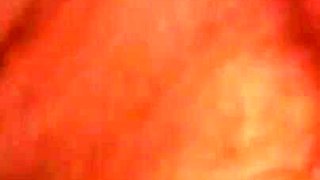 Amateur on the bed at home rubs her hairy pussy