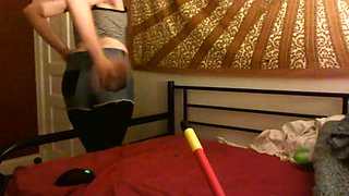 My flat chested chick fucks her self with long stick