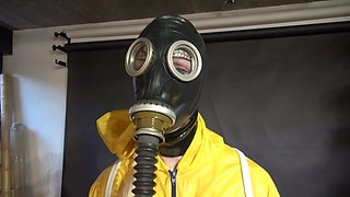 Watch Lady M Bound In A Yellow Rainsuit Wearing A Latex Hood And A Gasmask