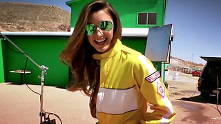 Big tits MILF posing behind the scenes