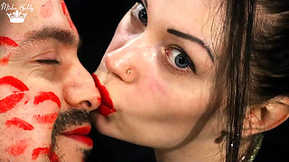 Covering Alex face with red lipsticks kisses