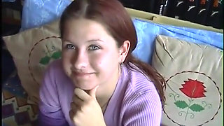 Young brunette strips and gives hard cock a hungry blowjob