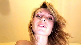 Busty babe playing with her big boobs