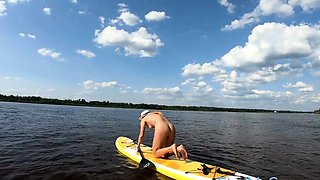 Big-Ass Blonde's Naked Walk on a Paddleboard