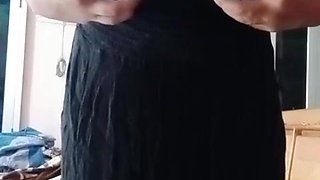 Indian Homo Crossdresser Gaurisissy demonstrating and pressing her large bra-stuffers in black sundress