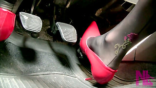 Driving in Scarlet Patent Pumps and Phillipe Matignone Rosed Stockings