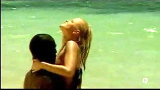 Young blonde white girl with black lover on the beach - Interracial