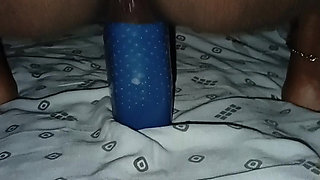 Inserting the bottle deep into the