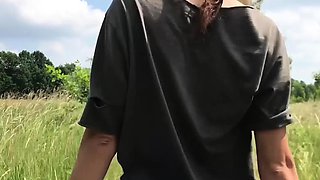 Skinny Russian beauty strips outdoors