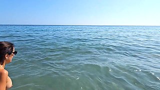 Between Passers-by, We Try to Relax on the Beach