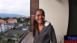 Thai beauty sucking cock with passion while her ponytail swings