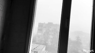 A sexy girl shows off her pierced tits at home