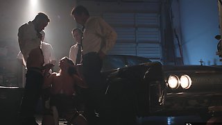 Angela White gets her big natural tits covered with cum in a gangbang scene.