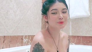 Busty babe playing with her big boobs
