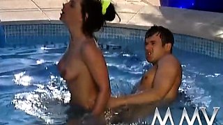 Brunette babe fucking in the pool